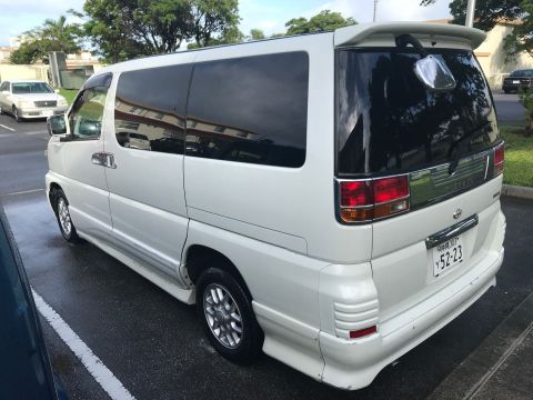 2002 Nissan Quest - Rear view of a white 2002 Nissan Quest minivan parked outdoors.