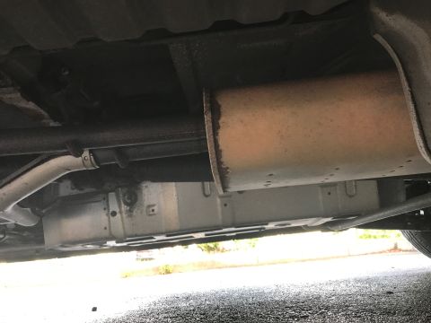2002 Nissan Quest - Underside view of vehicle's exhaust system, including muffler and pipes.