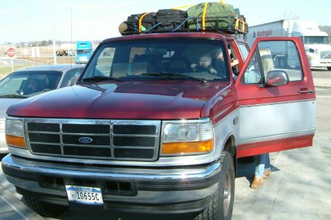 1996 Ford Bronco - 1996 Ford Bronco loaded with luggage, ready for a trip with a baby in the driver's seat.