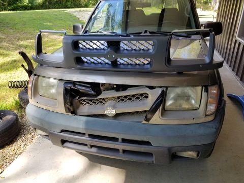 2001 Nissan Xterra - This grille was relatively inexpensive from eBay, and easy to install. While it was out, I changed the headlights, too (also from eBay).