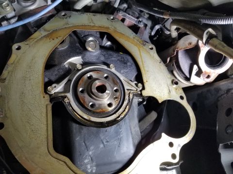 2001 Nissan Xterra - Even after a week not running, there was still wet oil at the top of the bellhousing, running down the separator plate. The white sealant o…