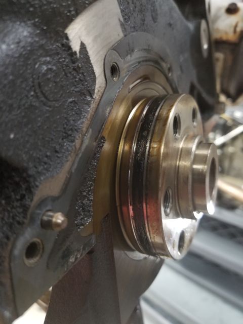 2001 Nissan Xterra - The rear main had been driven in too far, so it was easier to pull that housing than try to dig the seal out. While it was off, it was easy…