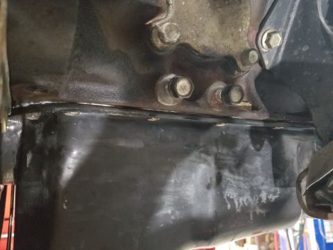 2001 Nissan Xterra - It only took 1 of the 2 supplied bags of RTV to seal the oil pan, and I let it dry overnight before dropping the engine back in.