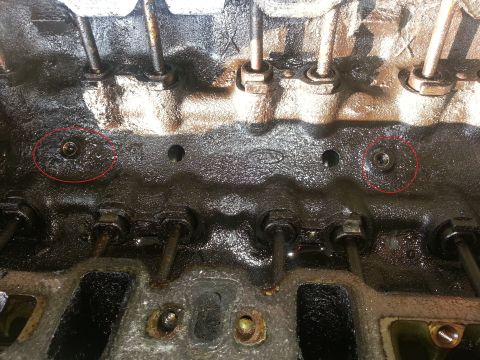 1994 Ford Bronco - Photograph of an engine cylinder head, not a technical document.