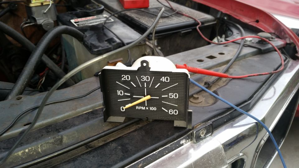 Tachometer connected to engine bay of a 1985 Ford Bronco