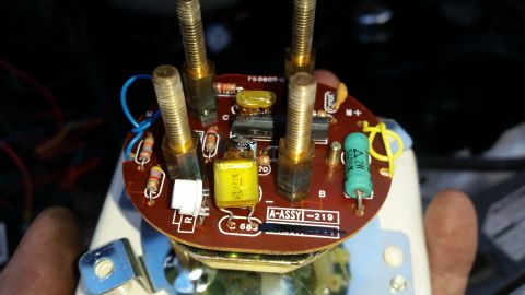 1985 Ford Bronco - A close-up view of the internal circuitry of a gauge or instrument cluster, featuring a printed circuit board with various electronic compo…