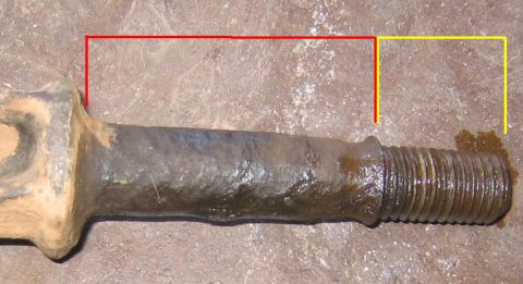 1978 Ford Bronco - A close-up view of a rusted metal component, possibly a bolt or shaft, with red and yellow lines indicating measurements.