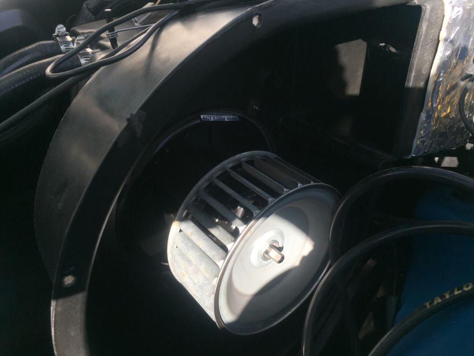 Vehicle blower motor and fan assembly with "MADE IN CHINA" visible.