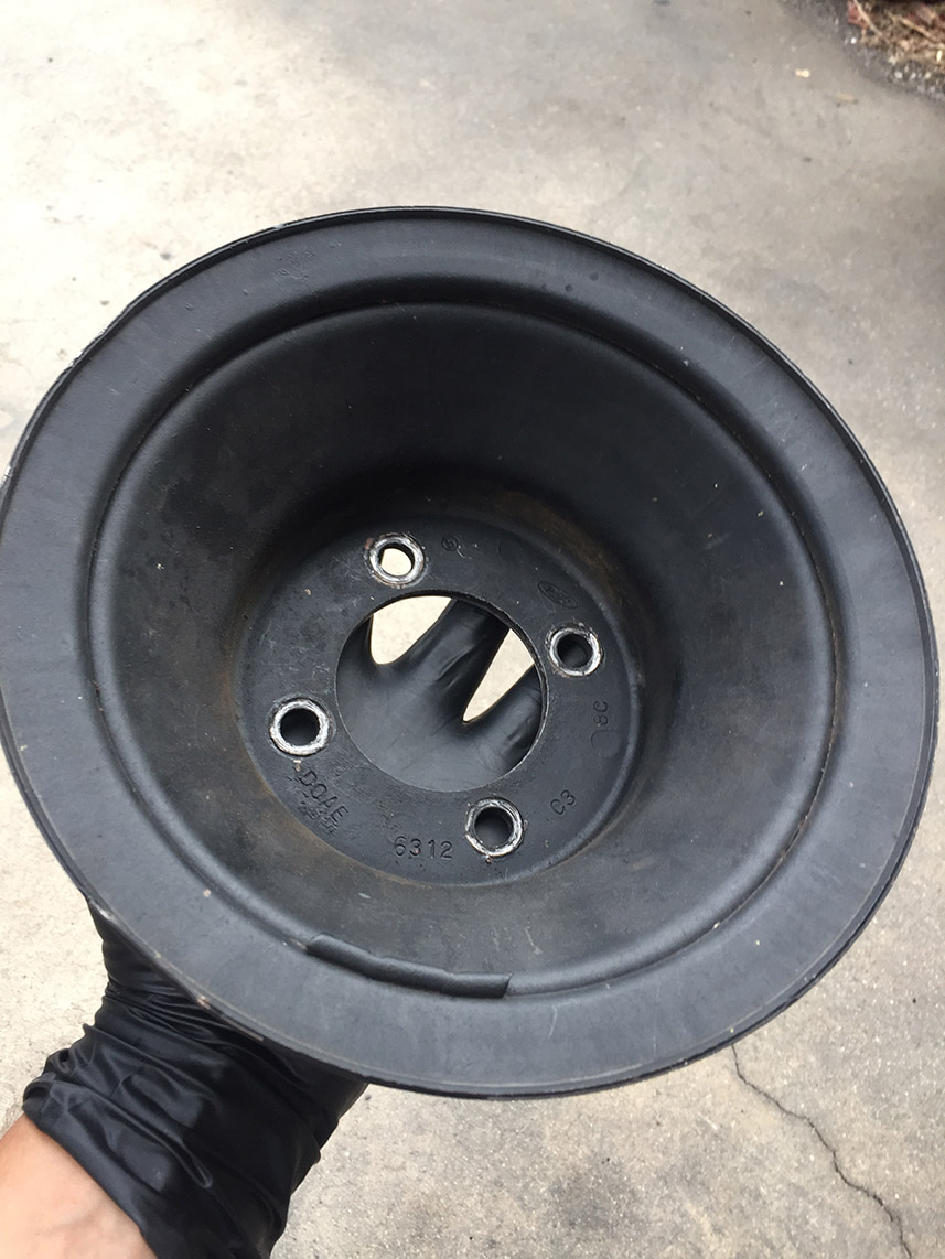 Black pulley with markings DOAE, 6312, and C3.