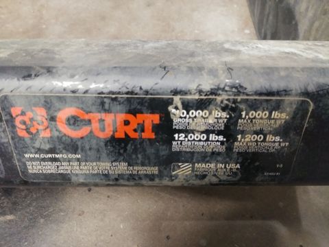 1996 Ford Bronco - A close-up of a black CURT brand trailer hitch receiver with a capacity sticker. The sticker shows weight ratings for gross trailer weight,…