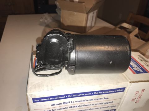 1964 Ford Fairlane - A black motor part with wires is resting on a cardboard box. The box has text and labels including "See instructions enclosed" and "FP-1 TR…