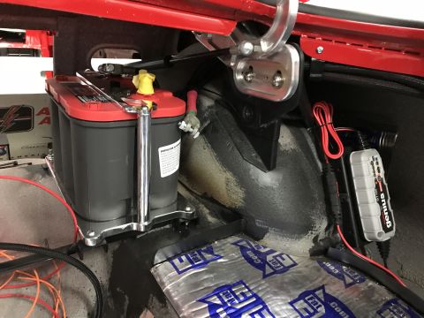 1964 Ford Fairlane - A red-top Optima battery and a Genius trickle charger are installed in the trunk, with sound-deadening material on the floor.