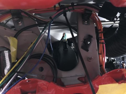 1964 Ford Fairlane - A close-up view of a vehicle's interior wiring and components, showing a tangle of wires and electrical parts.