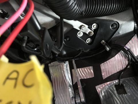1964 Ford Fairlane - A close-up view of a car's interior components, including wiring, insulation, and a yellow tag labeled 'AC'.