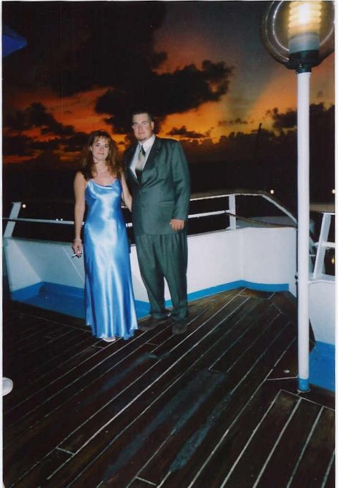 1994 Ford F-150 - A couple poses for a photo on a boat deck during a sunset.