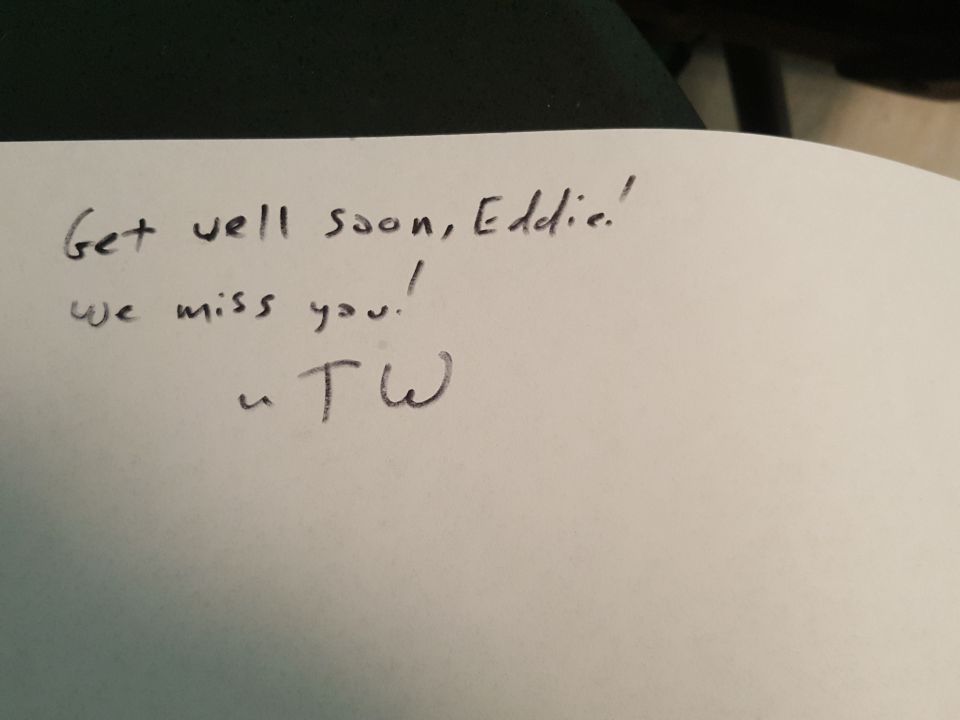 Handwritten note saying 'Get well soon, Eddie! We miss you! - TW'
