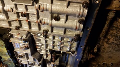 1994 Ford Bronco - Automatic transmission valve body detail, showing internal workings and bolted sections.