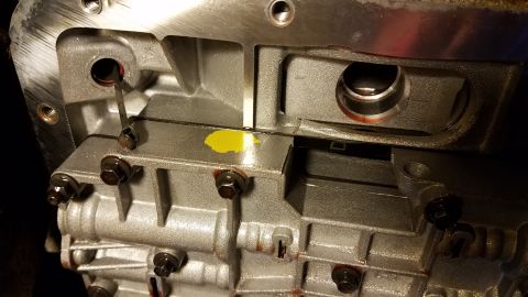 1994 Ford Bronco - This is a close-up view of an automatic transmission valve body, likely during a repair or inspection.