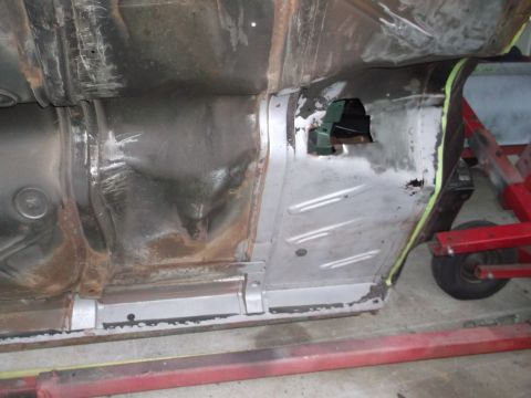 1962 Ford Galaxie - The underside of a vehicle shows significant rust and evidence of bodywork on the floor pan and frame.