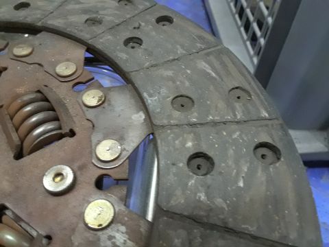 1985 Ford Bronco - This is a close-up view of a vehicle's clutch disc, showing signs of wear and tear.