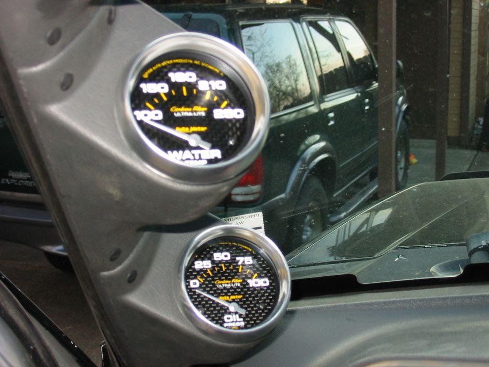 Close Up pic of Autometer 2 5/8" Water Temp and Oil Pressure gauges.