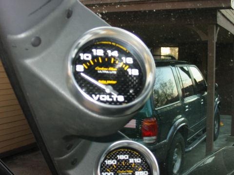 1991 Ford Bronco - Close up pic of top gauge - Auto Meter 2 5/8" volt meter gauge.