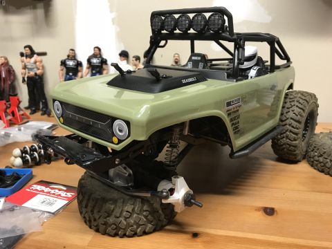 1989 Ford Bronco - This RC car body, labeled "DEADBOLT", is shown with off-road tires and a roll cage, not matching the 1989 Ford Bronco registry claim.