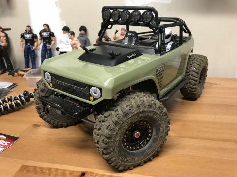 1989 Ford Bronco - This remote-controlled vehicle features a roll cage, large off-road tires, and a driver figure inside.