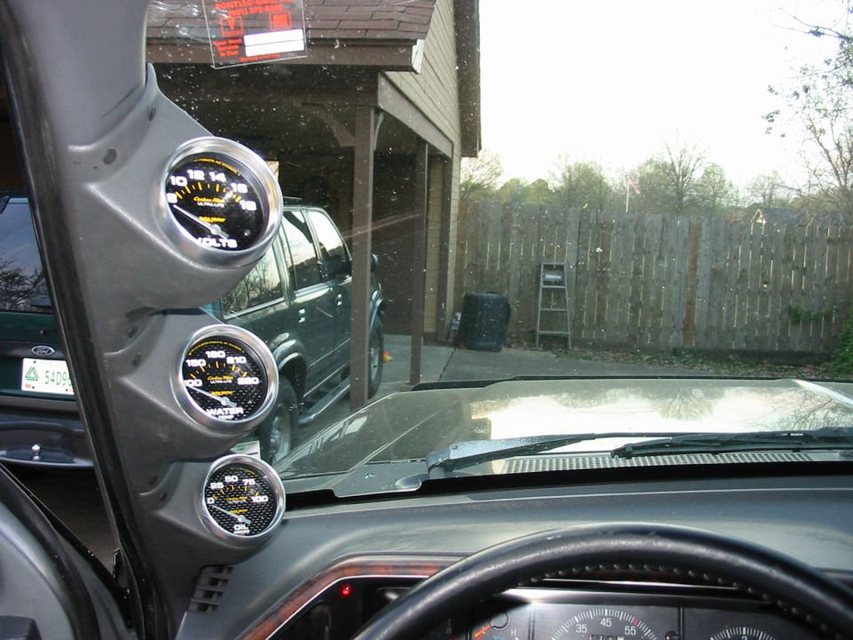 All three Autometer gauges mounted on the driver's side A Pillar.  Gauges are 2 5/8" Carbon Figer gauges.