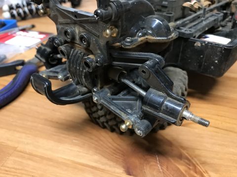 1989 Ford Bronco - Detail of a suspension component, likely from a remote control vehicle, showing intricate plastic and metal parts.