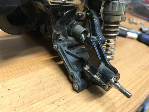 1989 Ford Bronco - Close-up of a remote control car's suspension system, showing mechanical components.