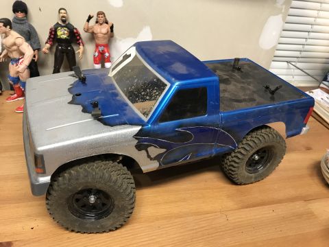1989 Ford Bronco - Remote control truck with a custom blue and silver paint scheme flame decals.