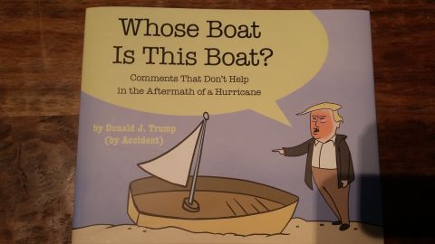 Book cover titled 'Whose Boat Is This Boat?' with cartoon of Donald Trump pointing at a boat