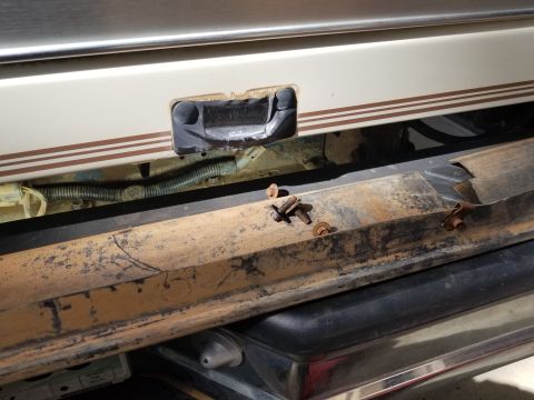 1995 Ford Bronco - Dropping the skidplate or tank is easier working above the bumper because the receiver blocks access from below. The filler's bolts are sti…