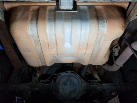 1995 Ford Bronco - Since the tank was nearly dry, it only took a ladyslipper to support the tank while I dropped the skidplate to hammer it flat. There's a sm…