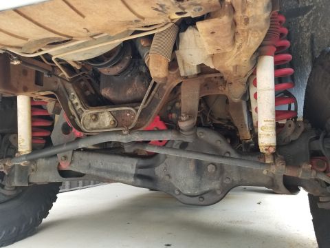1995 Ford Bronco - The gaudy red lift seems to have been installed almost well-enough, but there's a lot of slop in the suspension, and some significant engin…