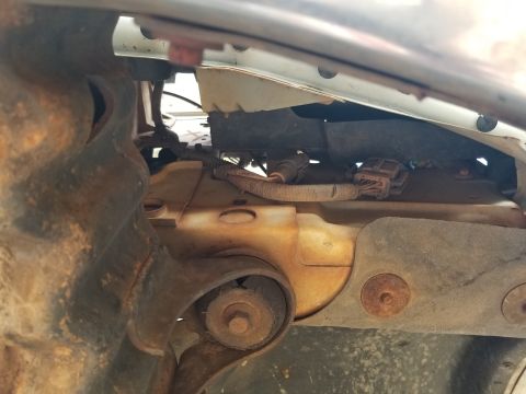 1995 Ford Bronco - The OHC temperature sender is beside the DRL jumper under the L headlight. Since this body mount is splitting, they all need to be replaced…