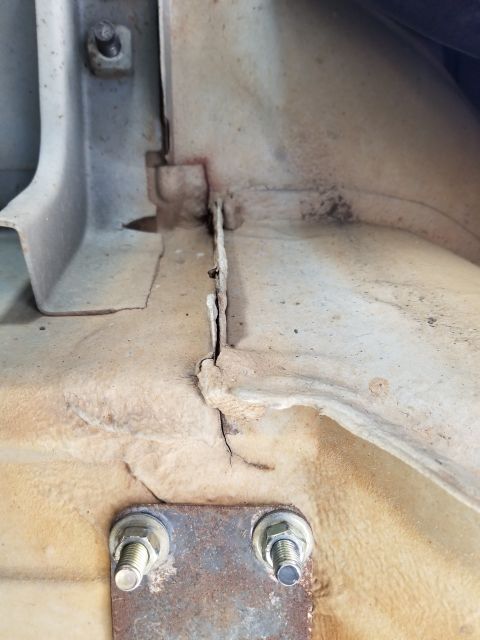 1995 Ford Bronco - There are a few cracks in the body (this is the passenger rear footwell), and the poorly-engineered cage installation probably isn't helpin…