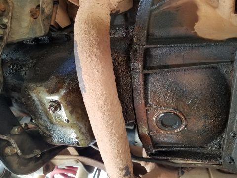 1995 Ford Bronco - The oil pan & bellhousing are literally dripping-wet. At this point, I can't tell where it's all coming from, but the pan gasket is the mos…