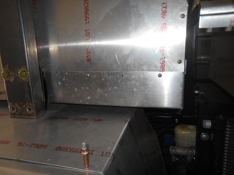 1992 Ford Bronco - Close-up view of the aluminum construction of a vehicle, showing stamped markings on the metal sheets. Visible text includes "LOT 1999388",…