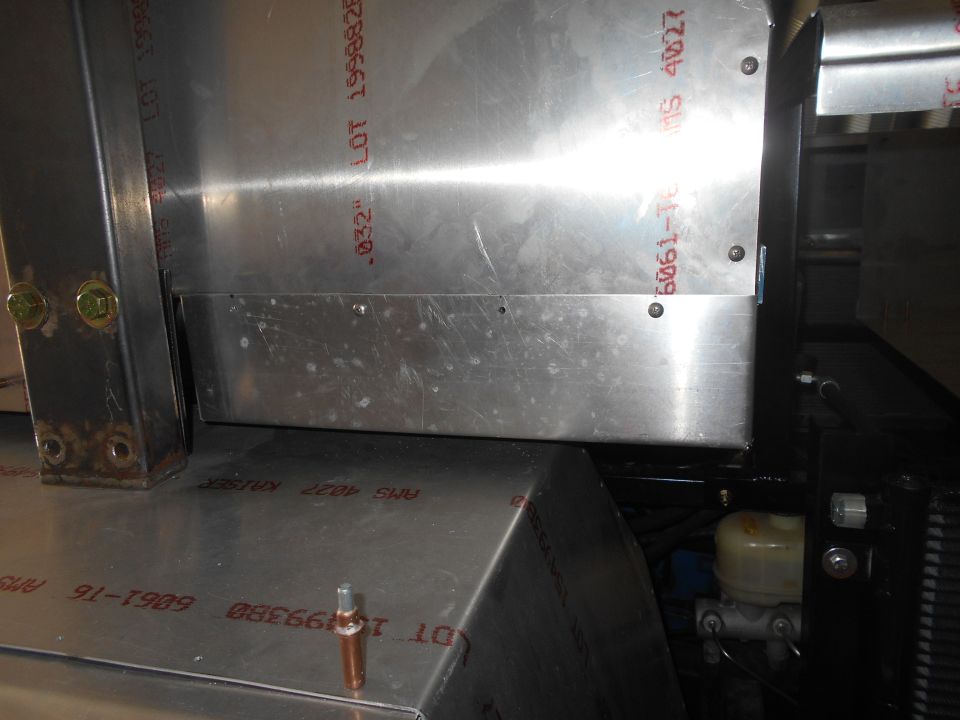 Aluminum vehicle construction with stamped markings.