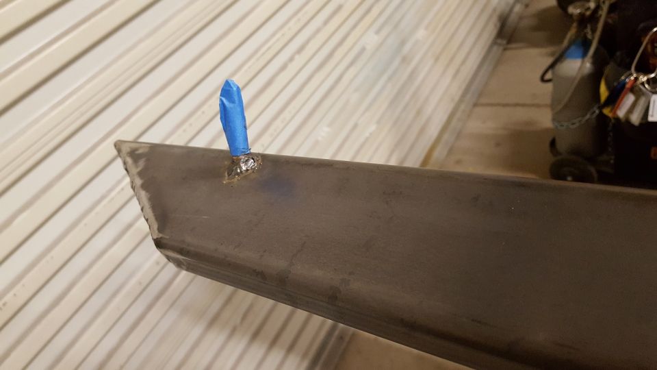 This is a closer shot of the front mounting location.  While this is not the only mounting location (there are 4), this will aid in the stability of the slider in addition to removing any possibility of the sliders bouncing against the front and rear of the truck under conditions that might cause them to have a different simple harmonic motion than the rest of the truck--like having unbalanced tires for example.
