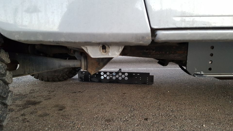 I decided to make the rock sliders to go along with the step.  In order to mount it to the front of the truck, I've decided to use the fender mounting location.  In order to do this it is necessary not only to remove the bolt that holds the lower part of the fender in place, but to also remove the threaded clip.