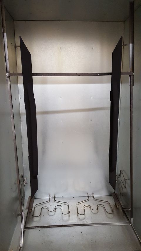 1995 Ford Bronco - A shot of the sliders/steps in the powder coating oven. In a few minutes these will be complete.