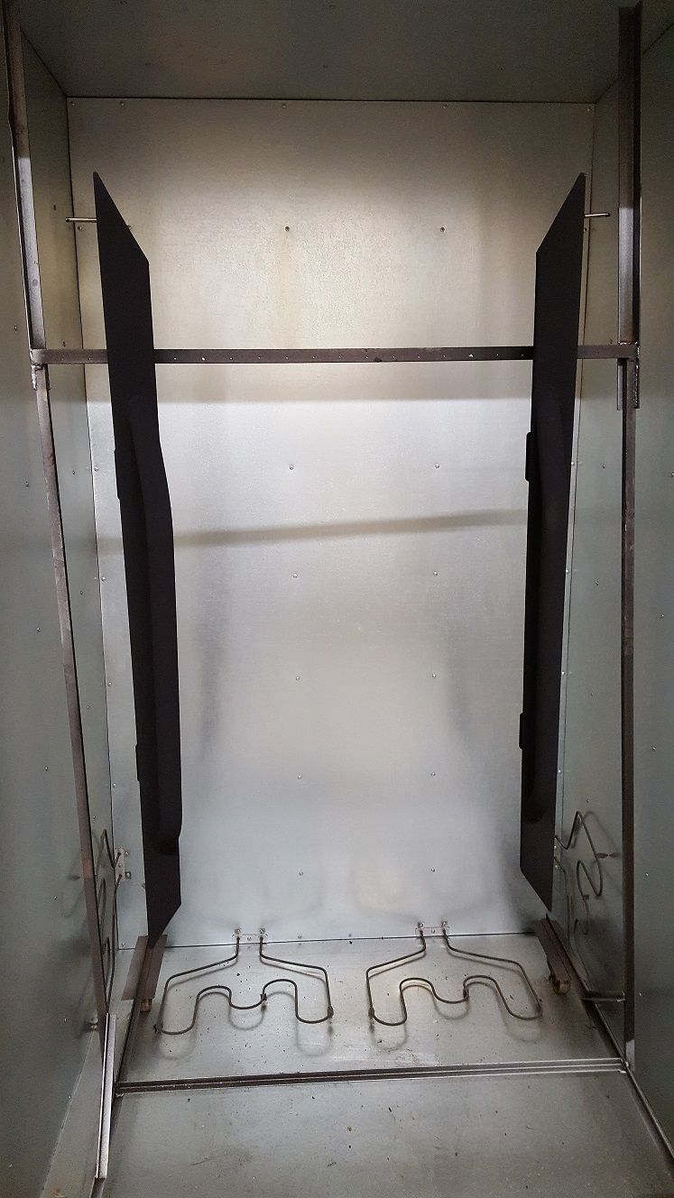 A shot of the sliders/steps in the powder coating oven.  In a few minutes these will be complete.