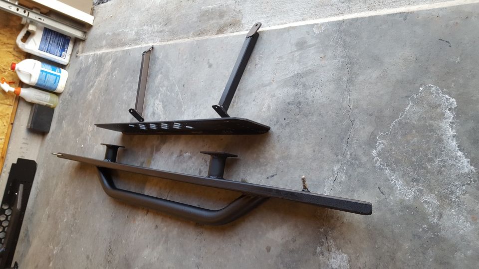 Here's a shot of the assembly that will bolt up underneath the truck.  From the outside in, there is the slider with step, the truss, and the bracing that will mount to the truck body.  The truss is held to the truck body at the top with 4 bolts.  These 4 bolts are in shear and will bear the weight of the step (and the person stepping on it).  Additionally, the braces (in compression) will bear the axial load that will be placed on the truss and transfer that load to the inside body mount locations.  All mounting locations on the truck are stock, and no holes need to be drilled.