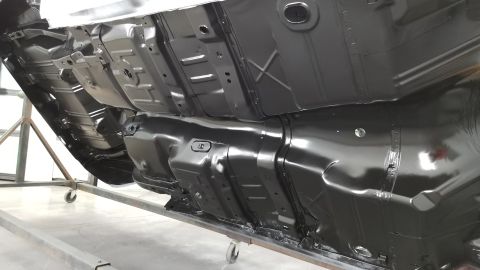 1970 Chevrolet Camaro - Underside of a vehicle undergoing restoration, showing the chassis and floor pan.
