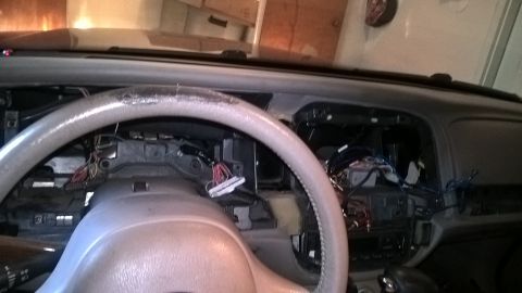 2004 Ford Crown Victoria - Dashboard of a 2004 Ford Crown Victoria with wiring exposed during repair.