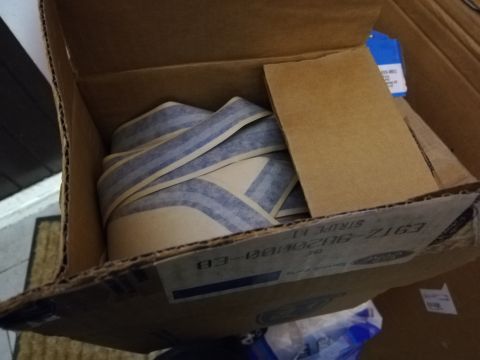 1996 Ford Bronco - A box contains a kit of vehicle stripes, with part numbers visible on the cardboard.