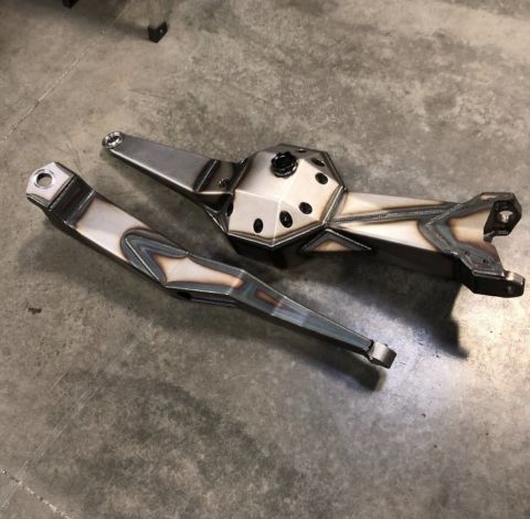 1979 Ford Bronco - Custom fabricated differential housing and control arm assembly, likely for an off-road vehicle modification.